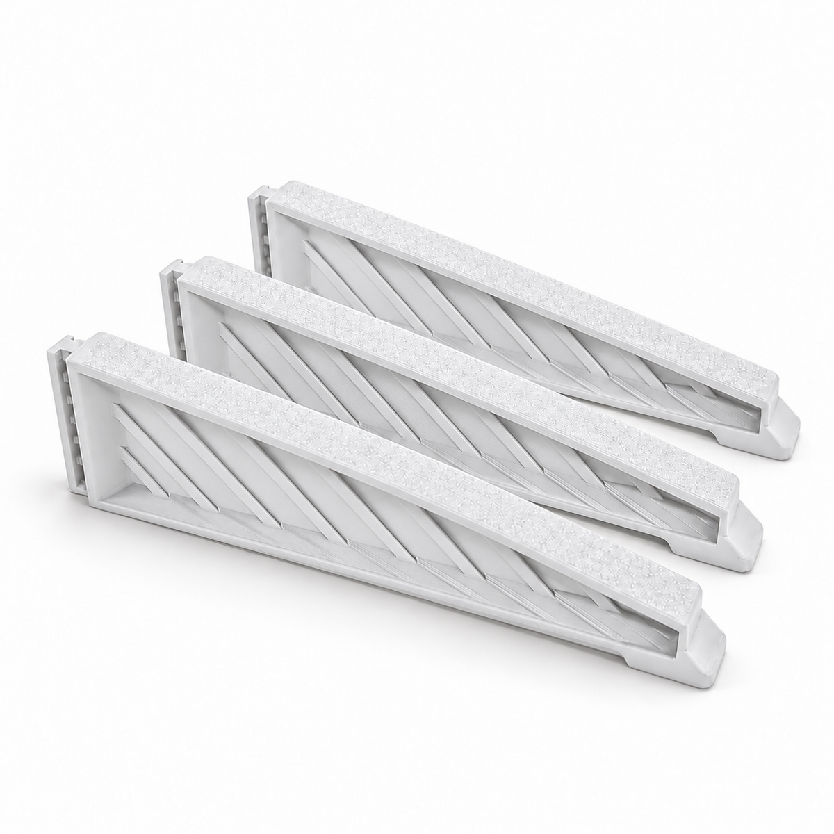 Three white medium Christmas tree stand replacement legs arranged on a white background