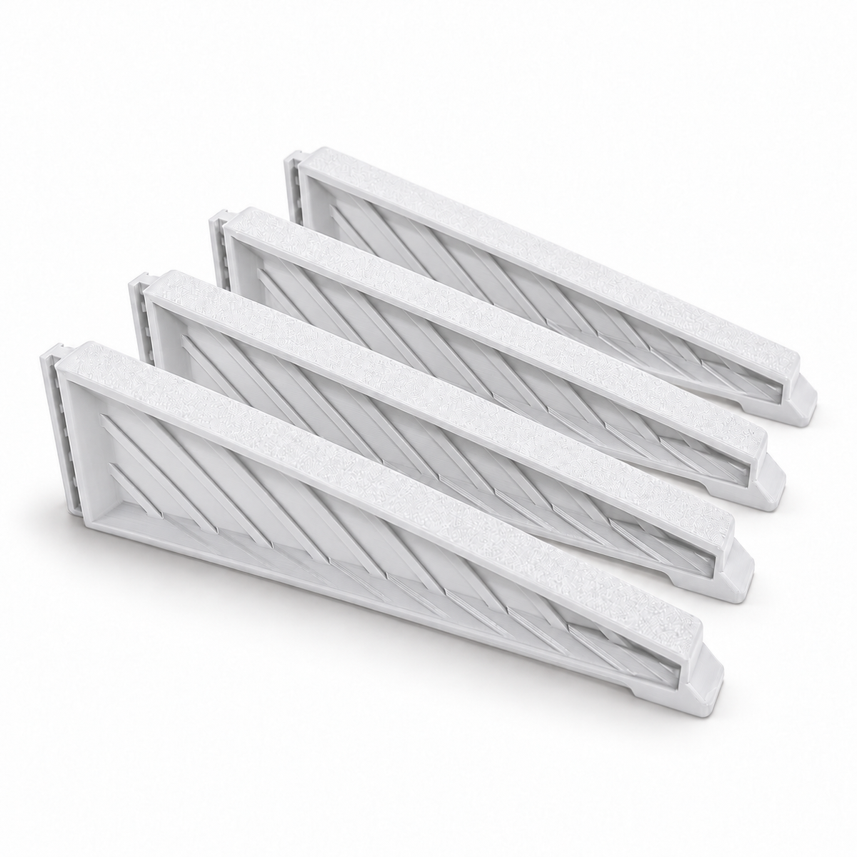 Four white medium Christmas tree stand replacement legs with ribbed sides on a white background
